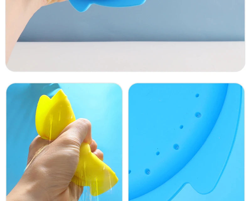 A hand is squeezing a yellow silicone splash flying ring toy into blue water.