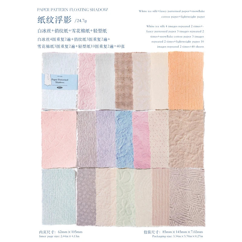 A collection of various shades and textures of paper sheets for scrapbooking, including light pinks, blues, and tans.
