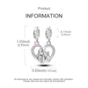 A pair of silver heart charms featuring a silhouette of two embracing figures.