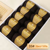 A box of dark brown Merino wool yarn balls with yellow labels, packaged for knitting projects.