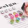 A collection of heart-shaped rhinestone flower charms beads in various colors and finishes displayed on a white background.