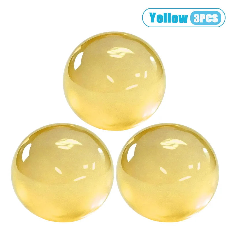 Three yellow squishy stress relief balls made from coconut oil