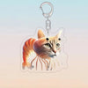 A stylized orange tabby cat head design on an acrylic keychain with a metal loop.