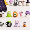 A collection of 24 spooky resin Halloween ornaments and figures, including ghosts, pumpkins, and witches.