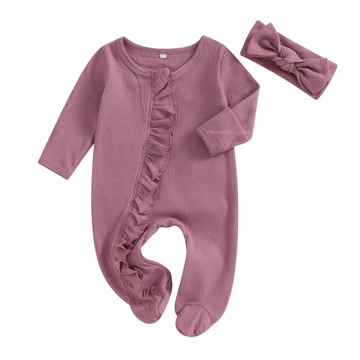 A mauve knit romper for a baby girl with ruffled details and a matching pink headband.