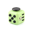 A lime green fidget cube with a rotating joystick and magnetic buttons.