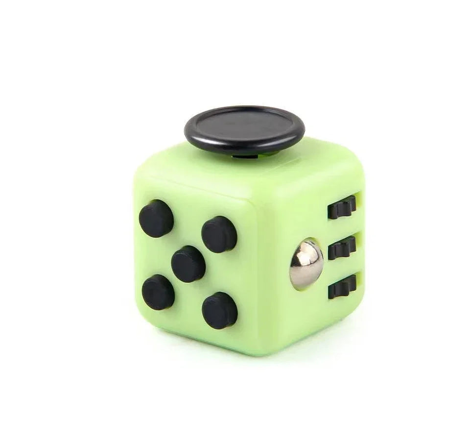A lime green fidget cube with a rotating joystick and magnetic buttons.