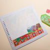 A sheet of double-sided non-stick release paper for diamond painting showing a colorful floral design.
