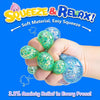 A hand is squeezing a green glitter stress ball, demonstrating anxiety relief.