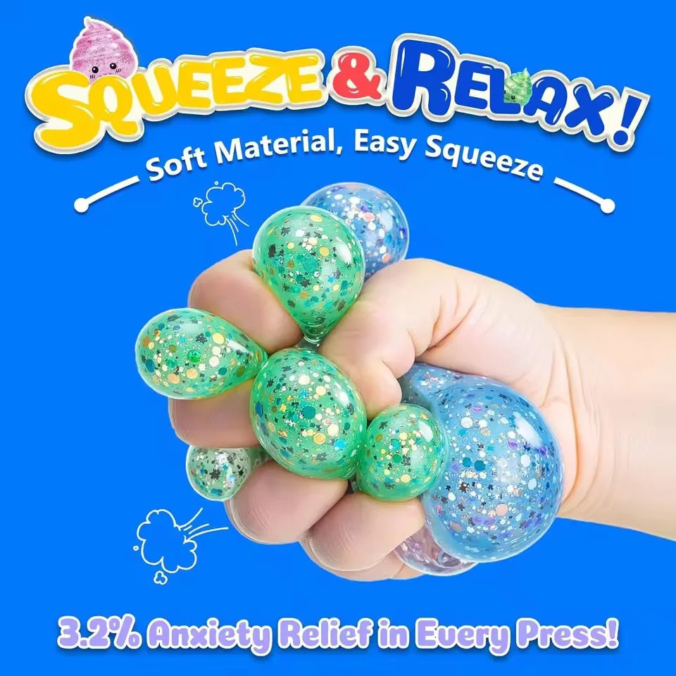 A hand is squeezing a green glitter stress ball, demonstrating anxiety relief.