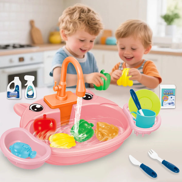 A pink toddler kitchen sink play set with plastic food items and utensils, being used by two young children.