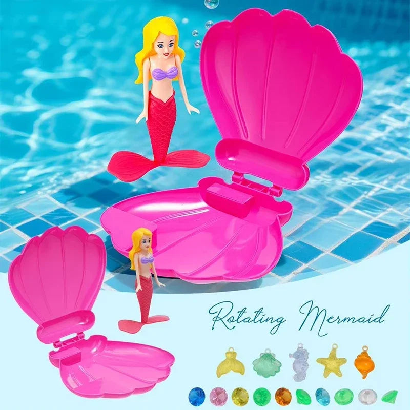 A pink rotating mermaid dive toy with an opening shell and various colored gems.