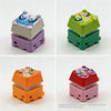 A set of colorful LED mechanical switch fidget keychains in various shapes and colors.