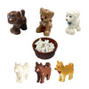 A set of six African wildlife animal building blocks, including a brown lion, a tan dog, a white elephant, and a yellow jacka
