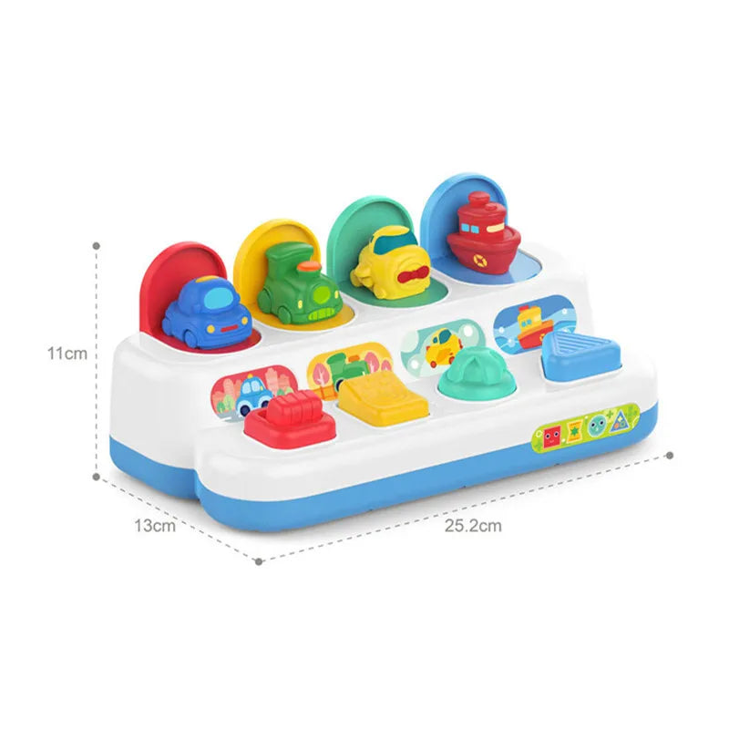 A white Montessori pop-up animal toy featuring colorful plastic animals like a blue elephant, yellow duck, and red bird.