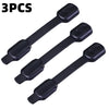 Three black adhesive baby safety locks for cabinets and drawers.