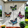 Set of four decorative iron butterfly wall art featuring vibrant colors mounted on a light gray wooden panel.