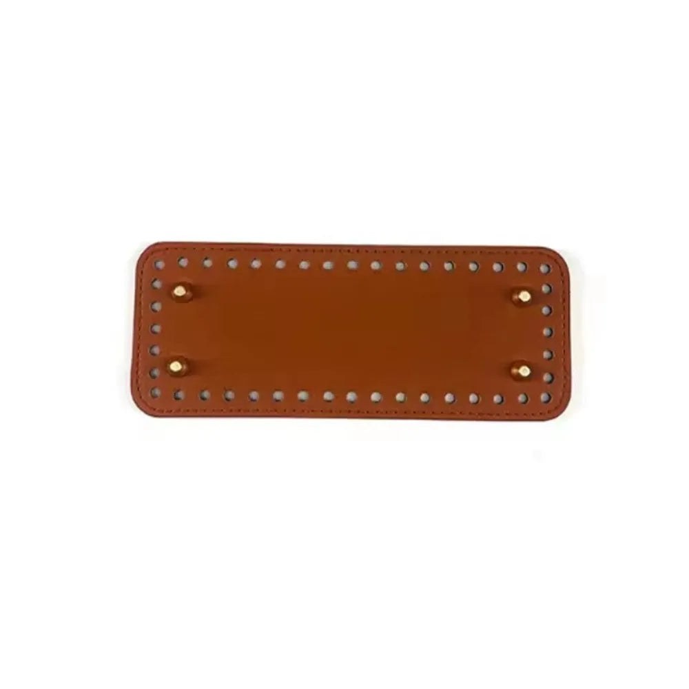 A rectangle shaped PU leather crochet bag bottom with pre-punched holes in a brown color.