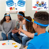 A family playing Guess Who I Am card board game with colorful cards and blue headband accessories.