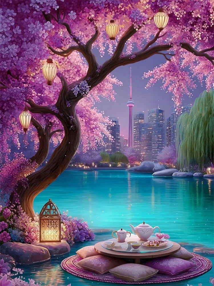 A vibrant landscape diamond painting kit featuring a pink cherry blossom tree over a blue lake with purple flowers and lush g