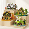 A miniature forest cabin building block set featuring a house, greenhouse, and windmill on a wooden base.