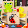 A collection of wooden shape puzzles and tangram learning toys featuring bright colors like green, yellow, and red.