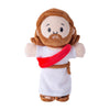 A plush toy of Jesus with brown hair and beard wearing a white robe and a red sash.