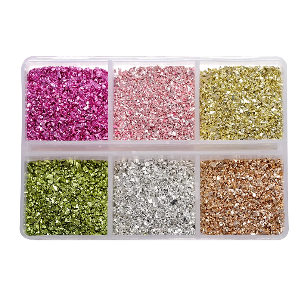 A clear plastic tray filled with various colors of crushed glass stones for resin and craft projects.
