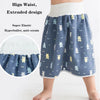 A child wearing blue patterned waterproof diaper pants with a high waist and extended design.