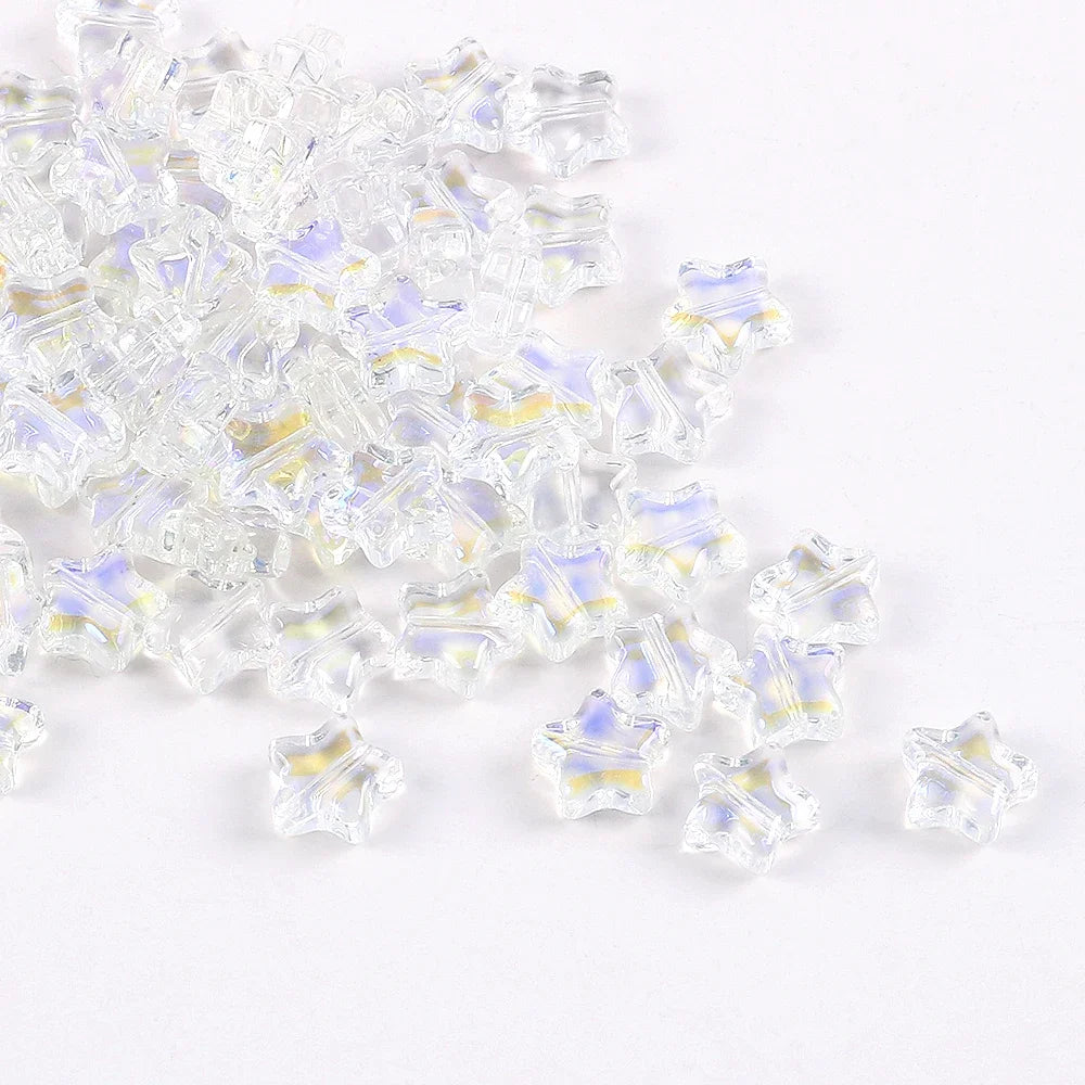 Clear glass star spacer beads with iridescent blue and yellow accents for jewelry making