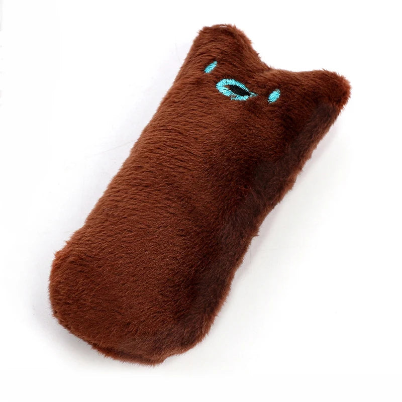 A dark brown, fuzzy plush toy shaped like a cat head with blue eyes.