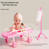 Pink first aid stretcher bed with drip rack used for doctor toys
