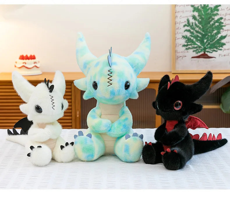 A collection of Toothless Dragon plush toys in various colors and poses displayed on a white surface.