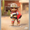 A collectible PVC figurine of Cassidy from Overwatch, featuring a brown hat and red jacket, standing on a clear base.