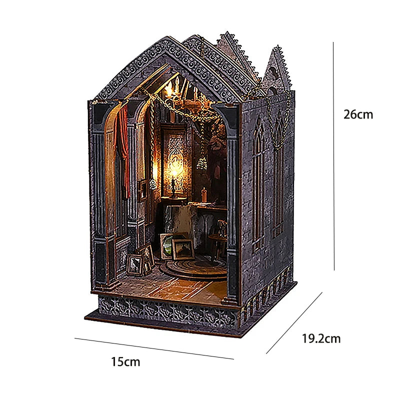 A dark, gothic-style DIY book nook kit featuring miniature furniture and an arched display.