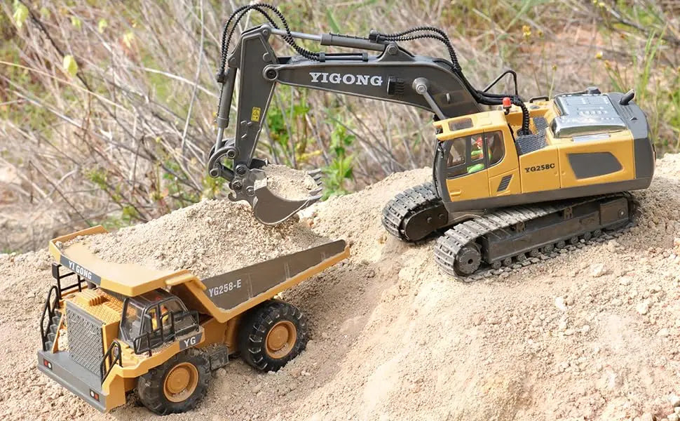 A yellow YIGONG excavator truck with a hydraulic arm is shown on a pile of dirt.