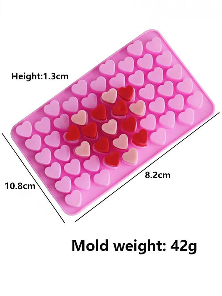 A pink silicone mold set shaped like a diamond with multiple heart-shaped cavities for candle making or crafting.