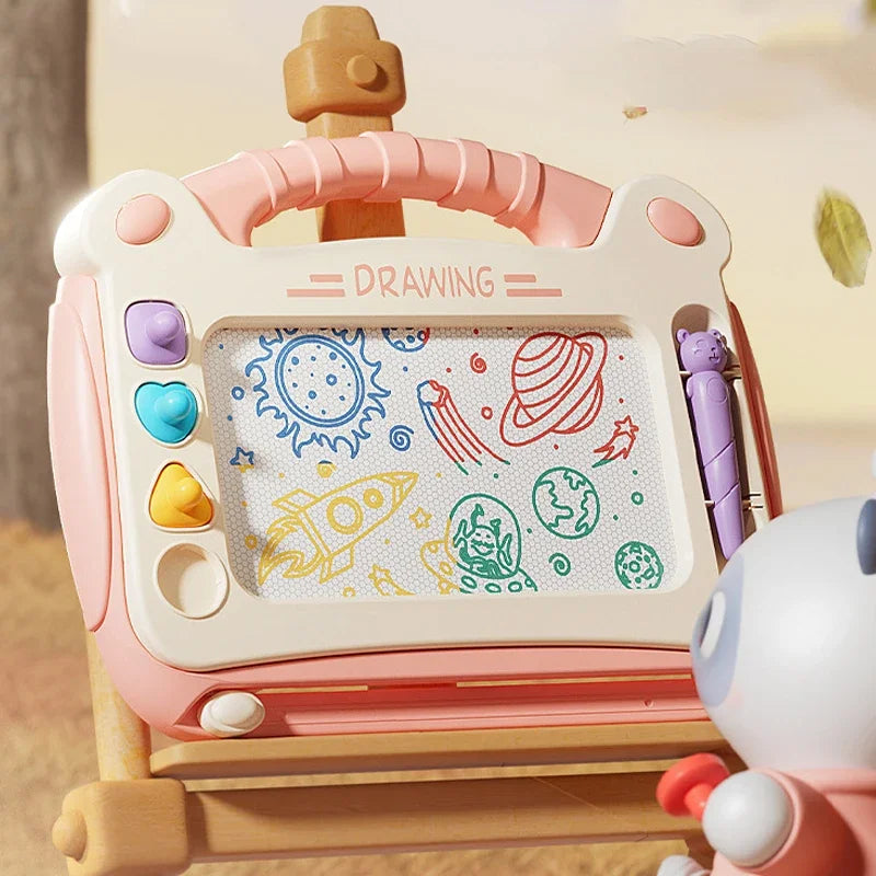 A pink magnetic drawing board for kids with various colorful drawings and a wooden frame.