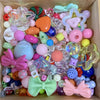 A variety of mixed colored acrylic loose beads and decorative shapes for jewelry making