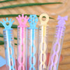 A collection of colorful plastic bubble wands with 5-hole designs in various shades of pink, blue, and yellow.