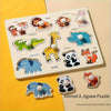 A wooden jigsaw puzzle board featuring various animal shapes like tiger, lion, elephant, and panda for early learning.