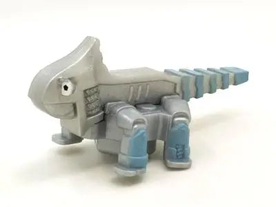 A gray die-cast dinosaur truck toy with a removable dinosaur figure.