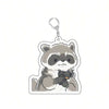 A cute raccoon character design on an acrylic keychain.