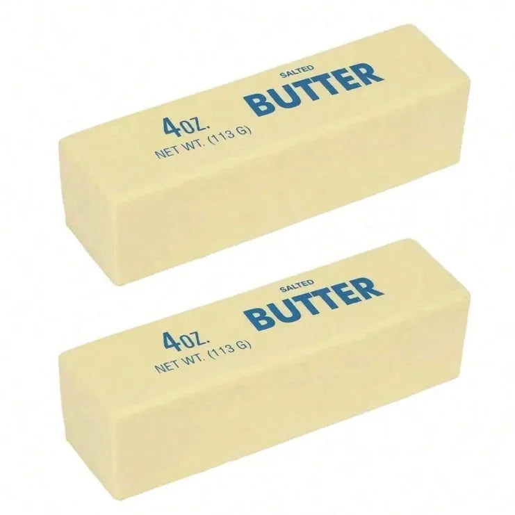 A rectangular block of salted butter labeled 4 oz net wt 113 g