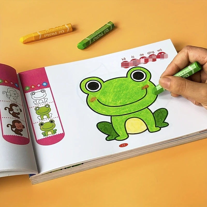 A hand holds a green pencil over a page of a coloring book featuring a happy green frog illustration.
