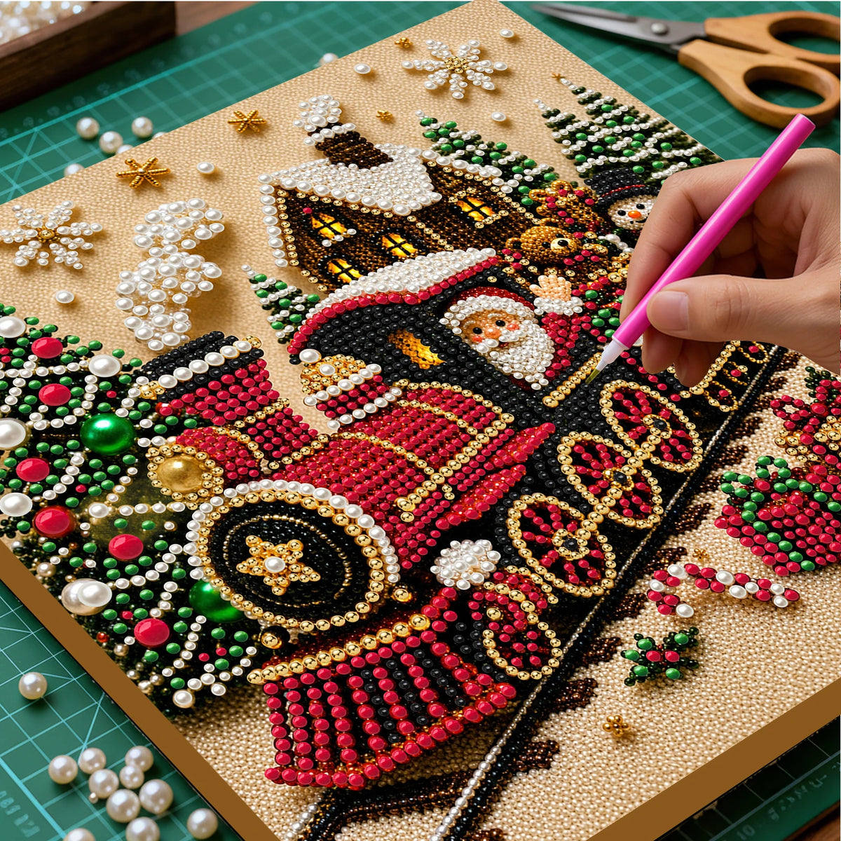 A hand is painting a Christmas scene on a diamond painting canvas using beads and sequins.