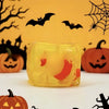 A yellow squishy ice cube toy set featuring Halloween themed ghost dumplings and bats against a yellow background.