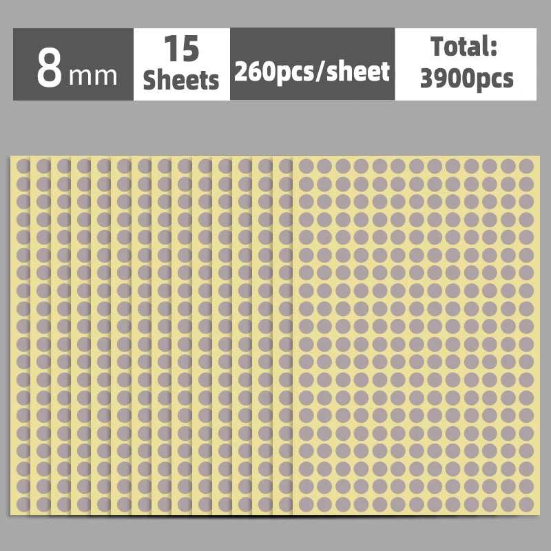 A sheet of round self-adhesive dot labels in a light yellow color, showing the grid pattern.