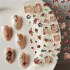 A sheet of nail art stickers featuring various roses and gothic elements for manicures.