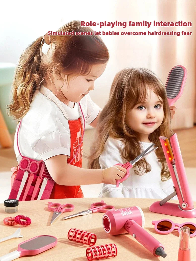 Two young girls play with a pink beauty salon kit including scissors, combs, and styling tools.